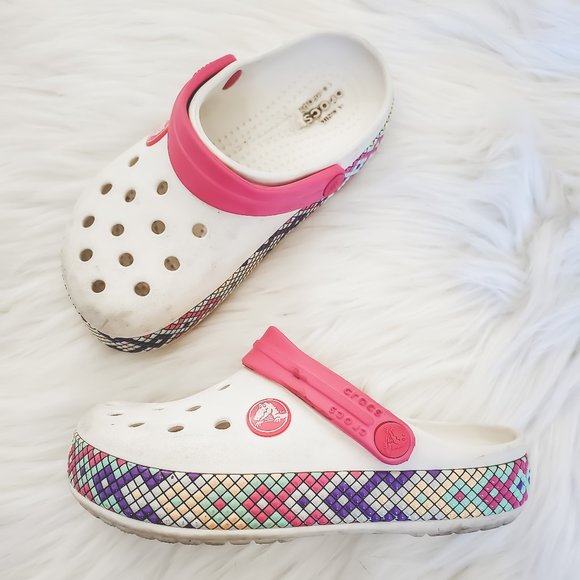 white and pink crocs